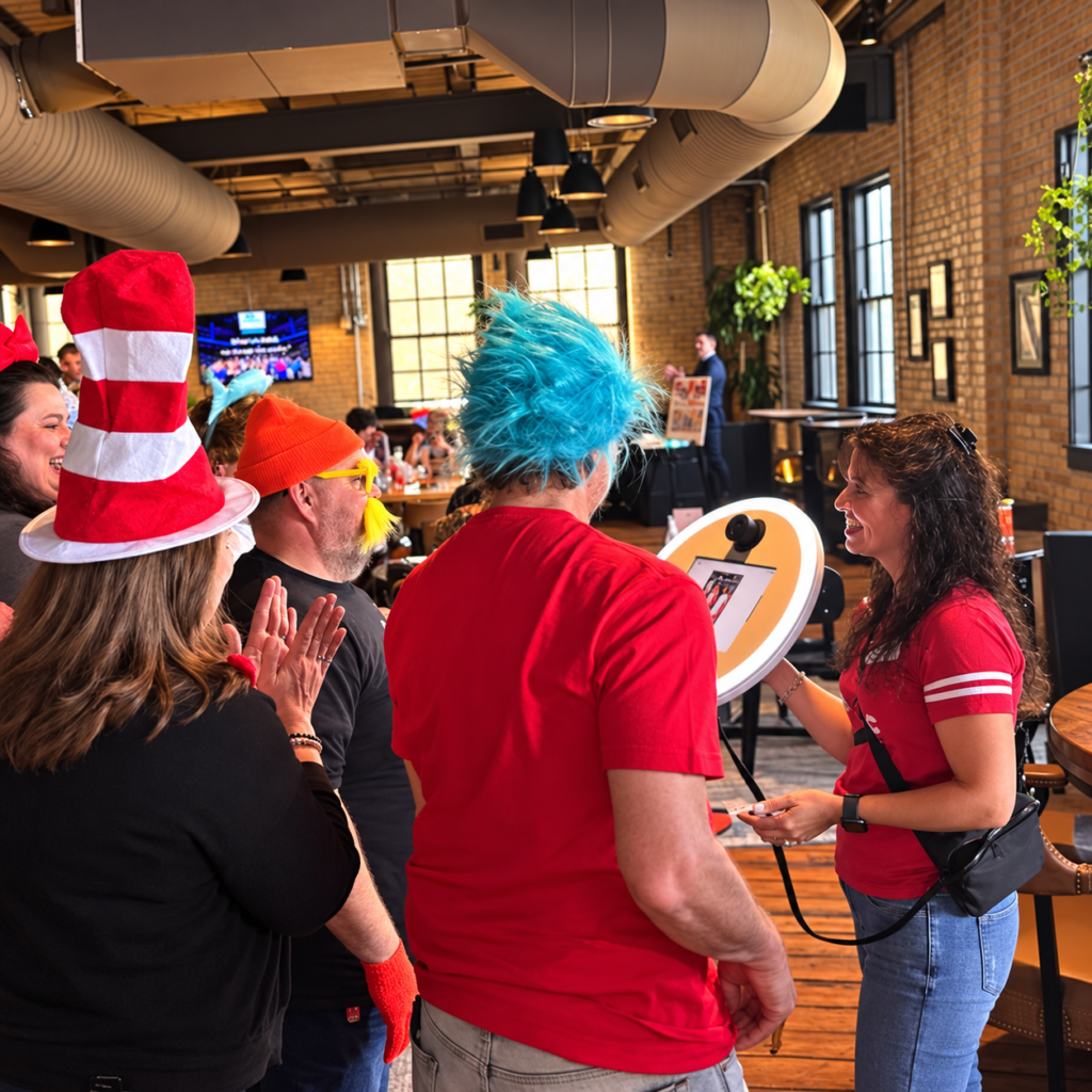 Roaming photo booth attendant taking photos of costumed guests at a Kansas City party