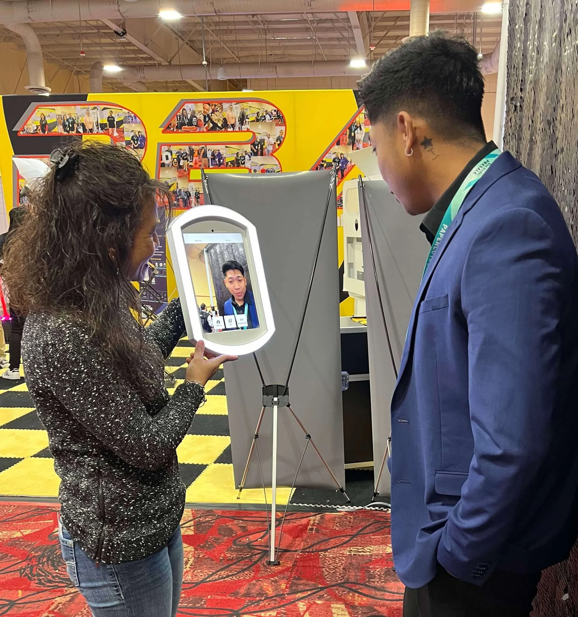 Roaming photo booth attendant capturing candid guest photos